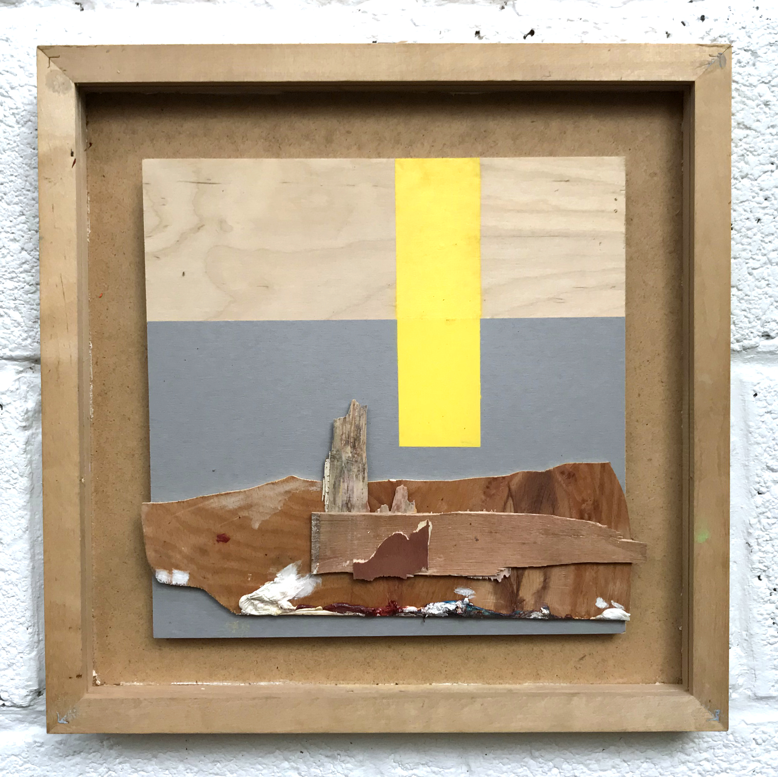 A layered, framed composition Made from wood, paint and plastic